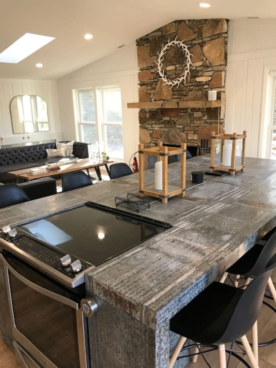 Kitchen island with inset cook top and convection oven.
