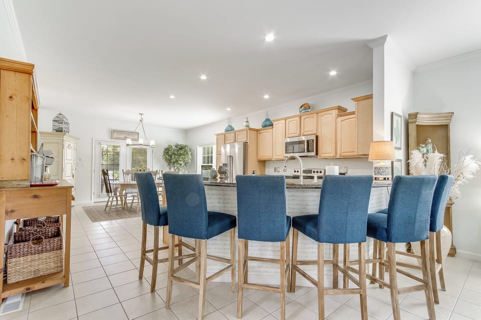 Take a seat- by the kitchen island or at the dining table  
