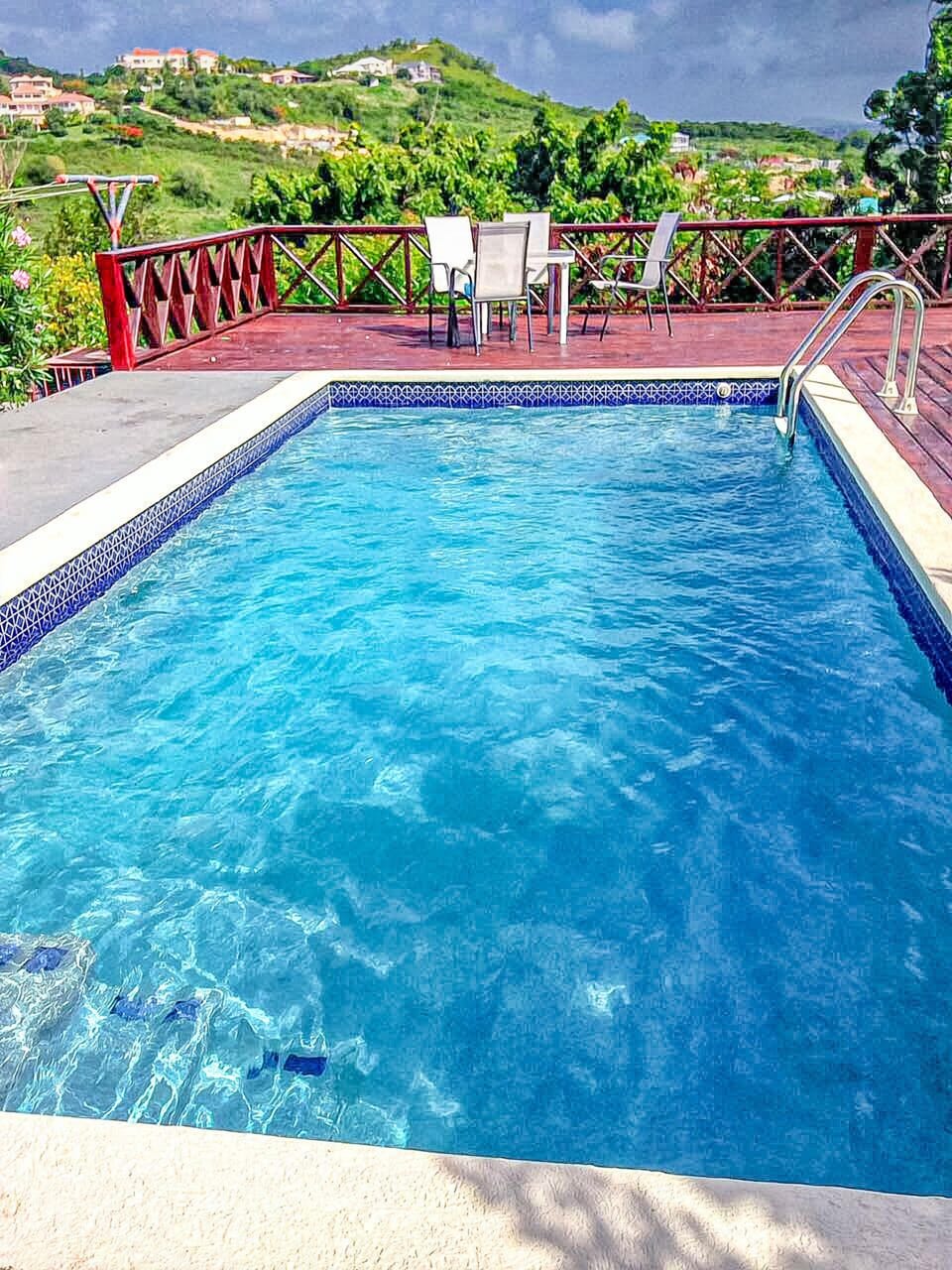 Pool with view, lounge seating area
