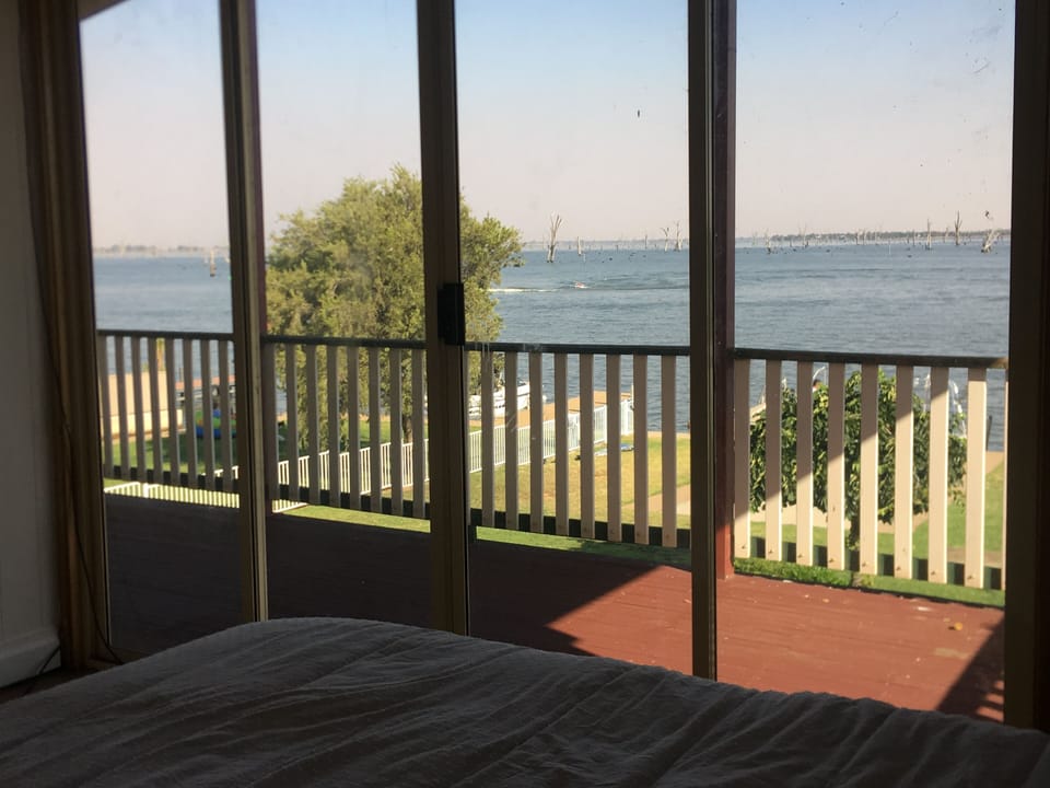 Master Bedroom with King Size bed and TVs and WATERVIEW