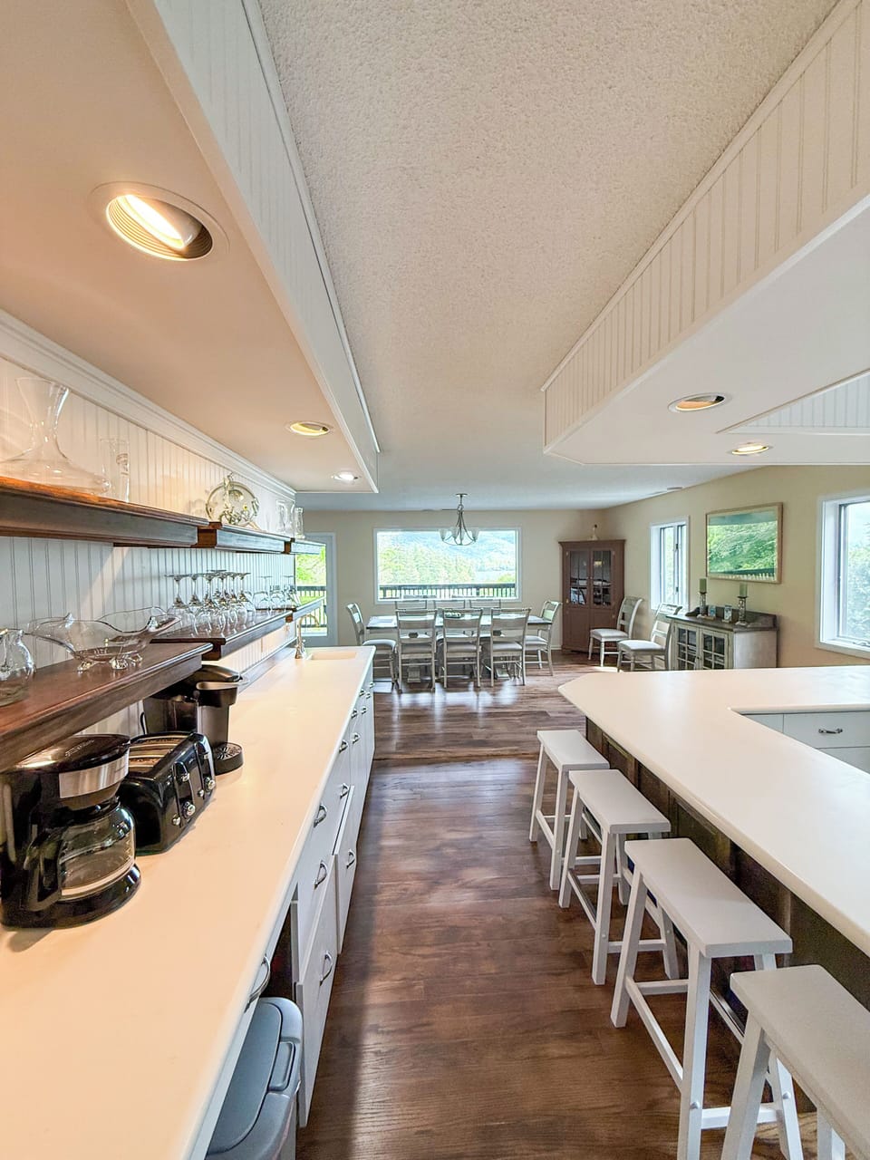 Kitchen on the 2nd Floor, with two ovens, a gas stove, and a bar with stools.