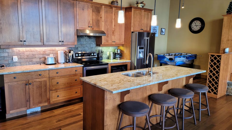 Kitchen from the front. 4 stools available for additional seating.