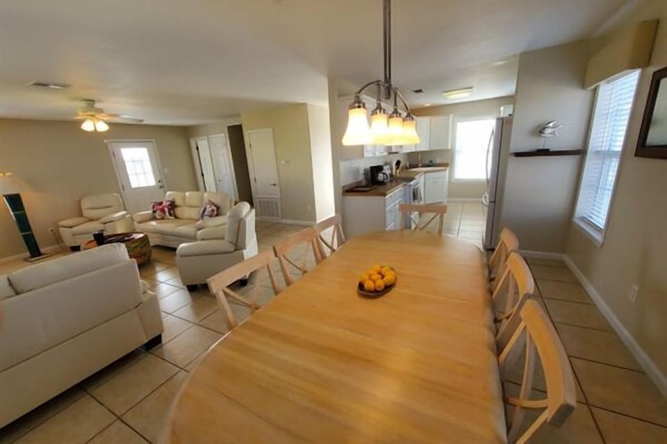Giant Dining Table Open to Living Room & Kitchen