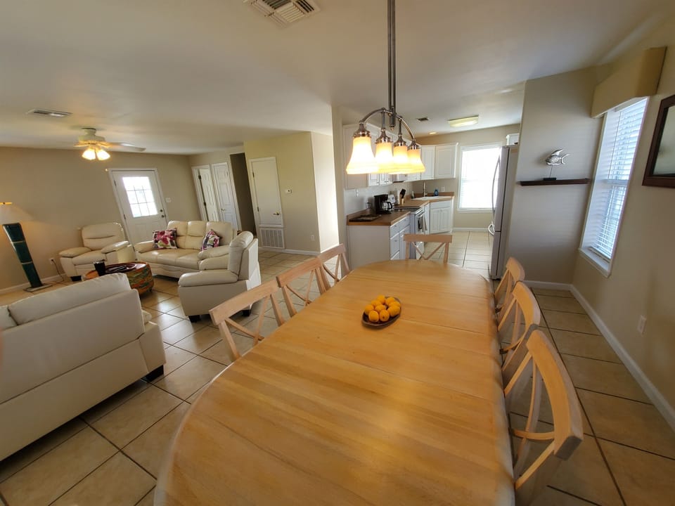 Giant Dining Table Open to Living Room & Kitchen