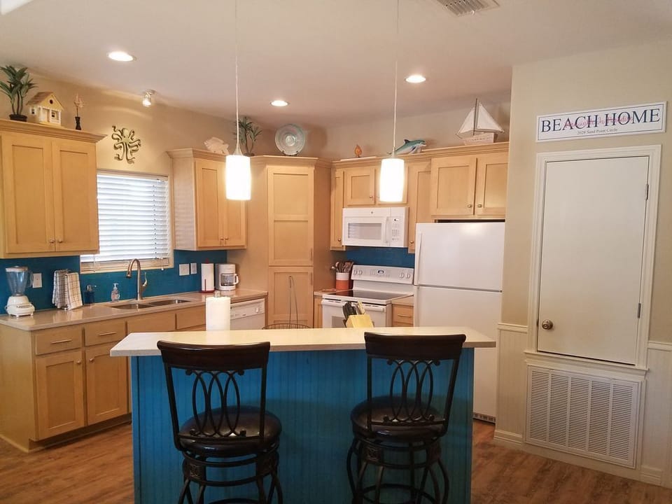 Kitchen has complete cookware, dinnerware, glassware and silverware.