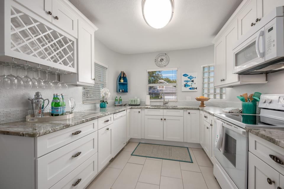 Renovated kitchen w/quartzite counters & new Shaker cabinets/drawers.