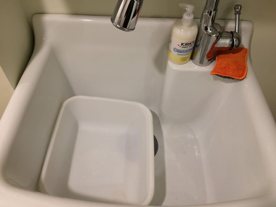 Laundry/kitchen sink for cleaning farm fresh produce or washing dishes. 