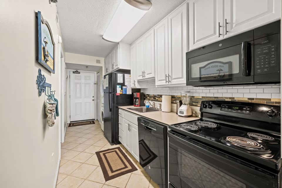 Full size appliances and a well-stocked kitchen await.