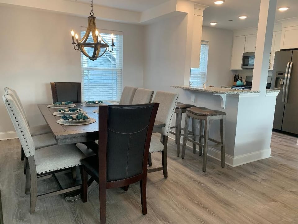 Indoor dining table seats 8, add the 2 kitchen bar stools and you can seat 10!  