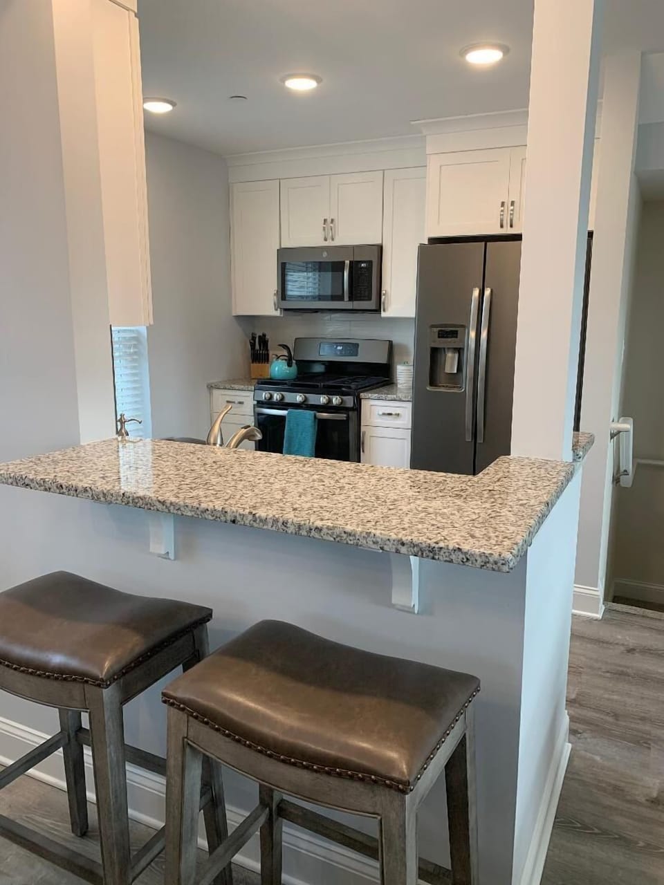 Kitchen bar seating with 2 stools.