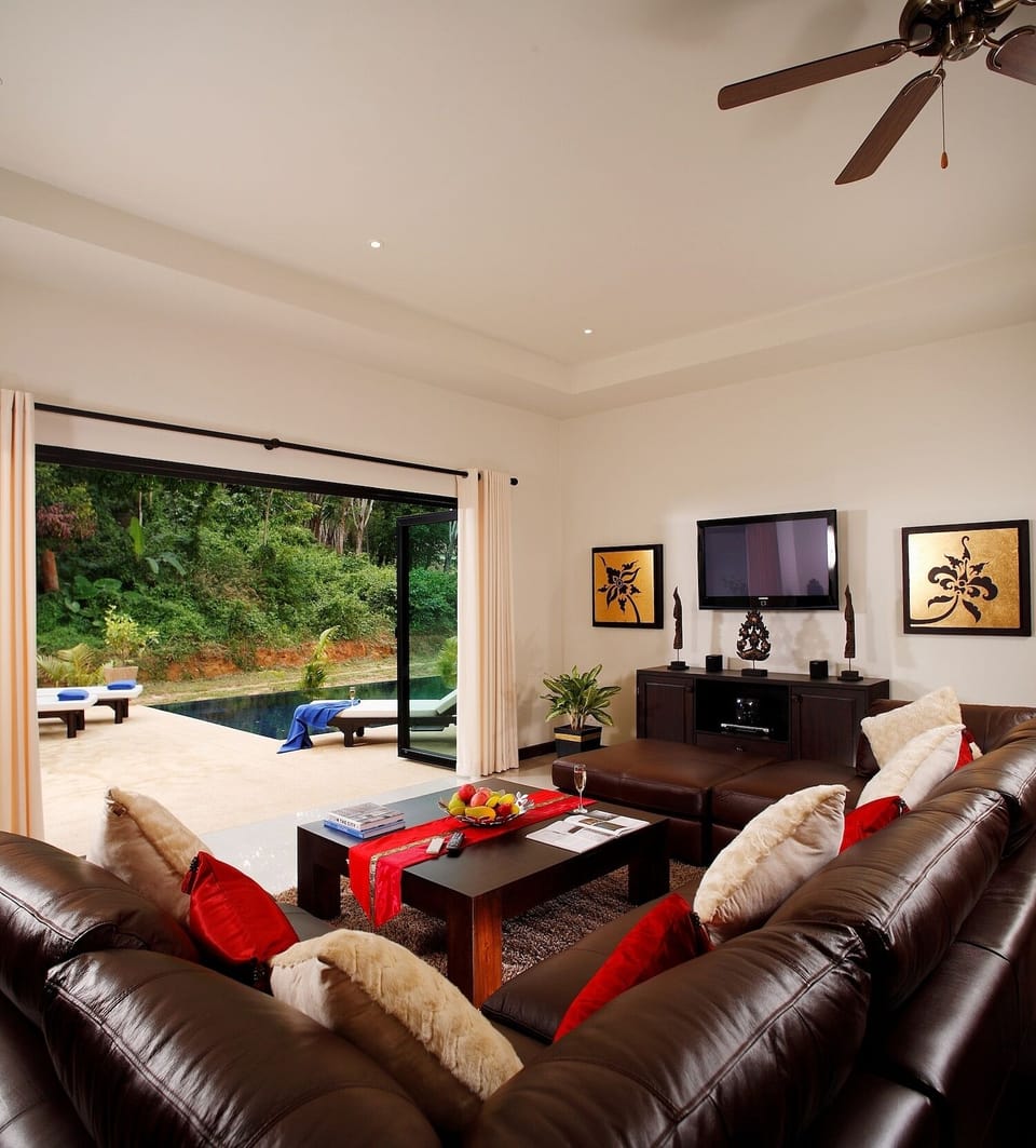 Living room opening to spacious garden