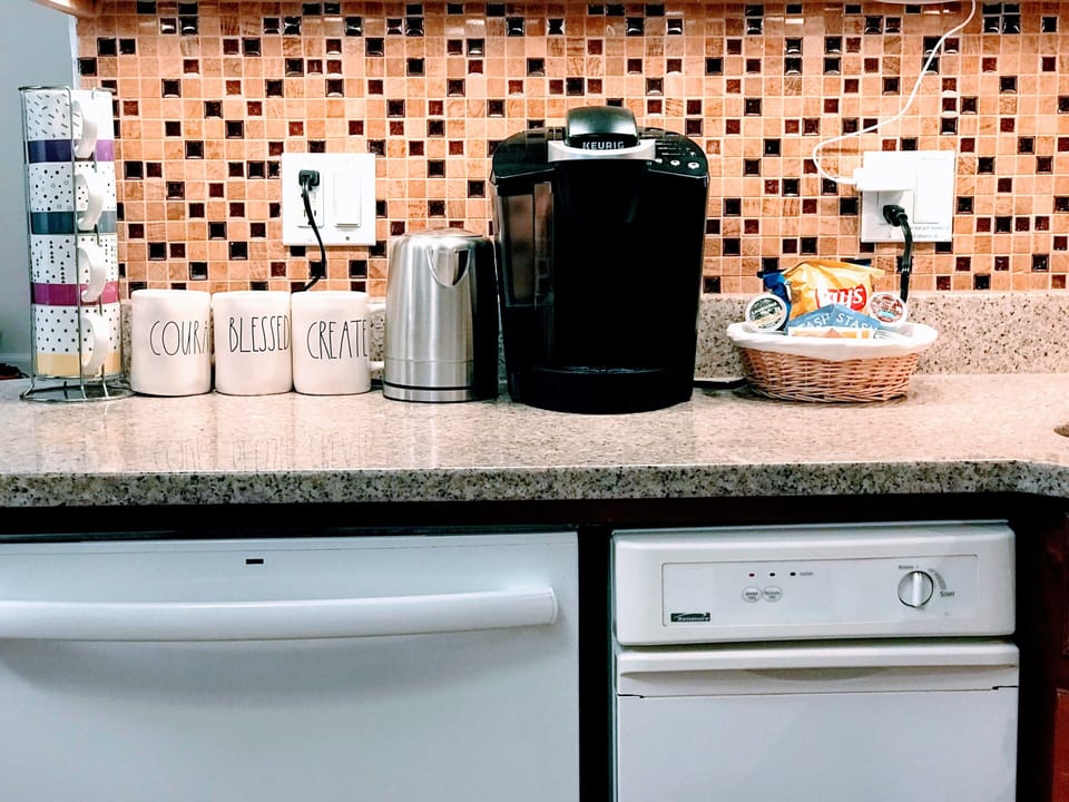 Complimentary Kcup coffee, tea & snack. Dishwasher, trash compactor.