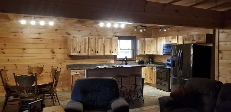 Open kitchen, dining, and living