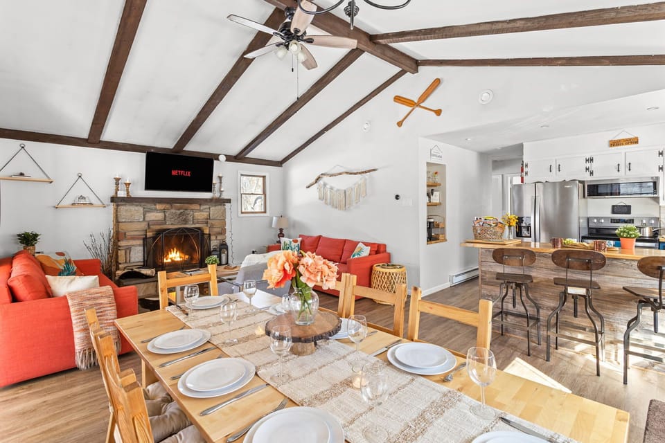 The dining table is connected to the living room and can seat up to 8 people.