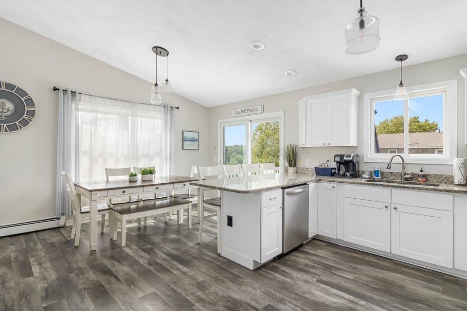 Kitchen open to Dining area with Slider to Elevated Deck.