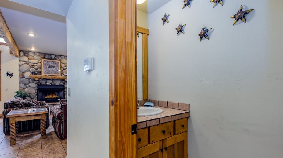 Downstairs powder room is located in hall by kitchen