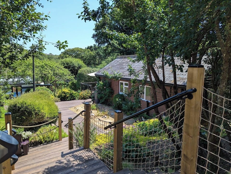 Steps from parking area / guest gate down to Woodside Lodge