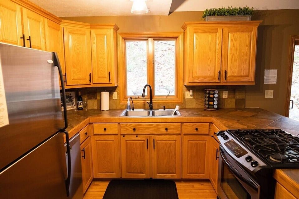 Fully stocked kitchen with loaded spice rack.