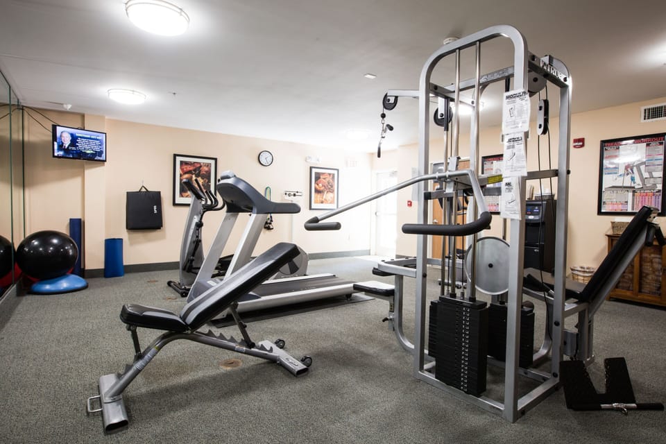 Fitness center equipped with various workout machines.