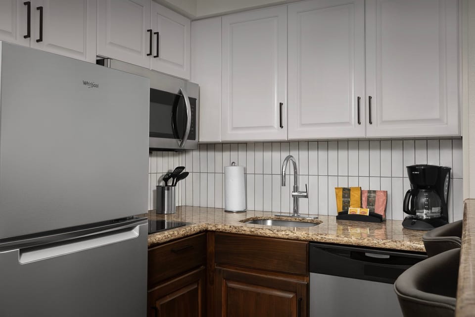 Whip up a meal in this stylish kitchen, complete with modern appliances and countertop space.