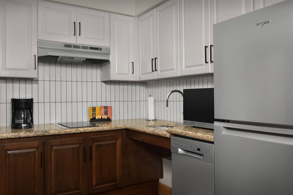 Cook up a storm in a sleek kitchen, equipped with all the essentials for a delightful meal.