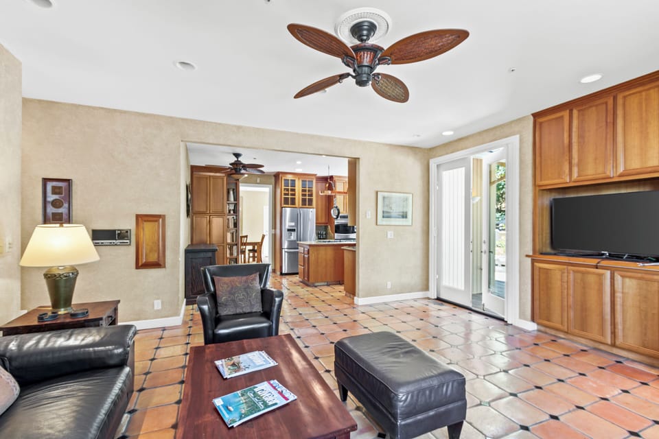 Views from TV room to kitchen and french doors to back deck.