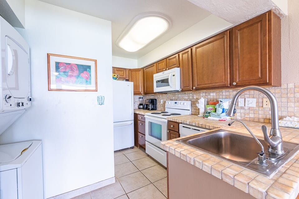 Washer & dryer in your condo, we provide your laundry soap.