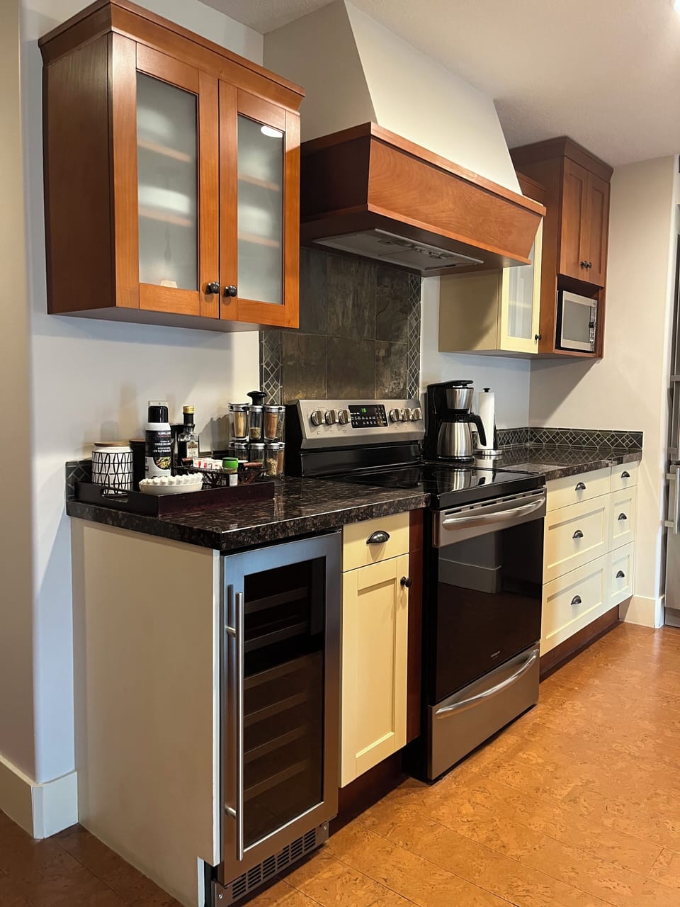 Kitchen features Granite counters, Wine Fridge and Stnls Steel Appliances.