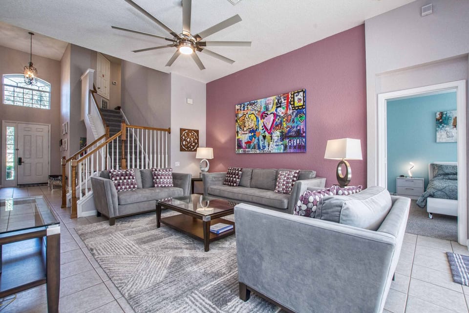 Living room with convenient access to both master bedroom suites.