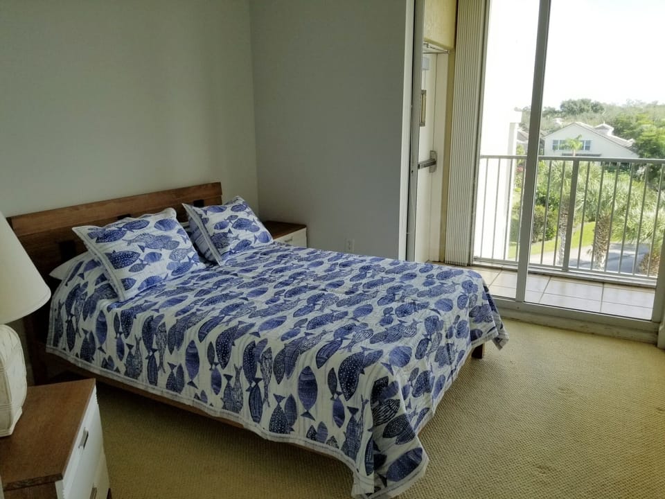 Queen bedroom facing east view, blackout shades.  balcony