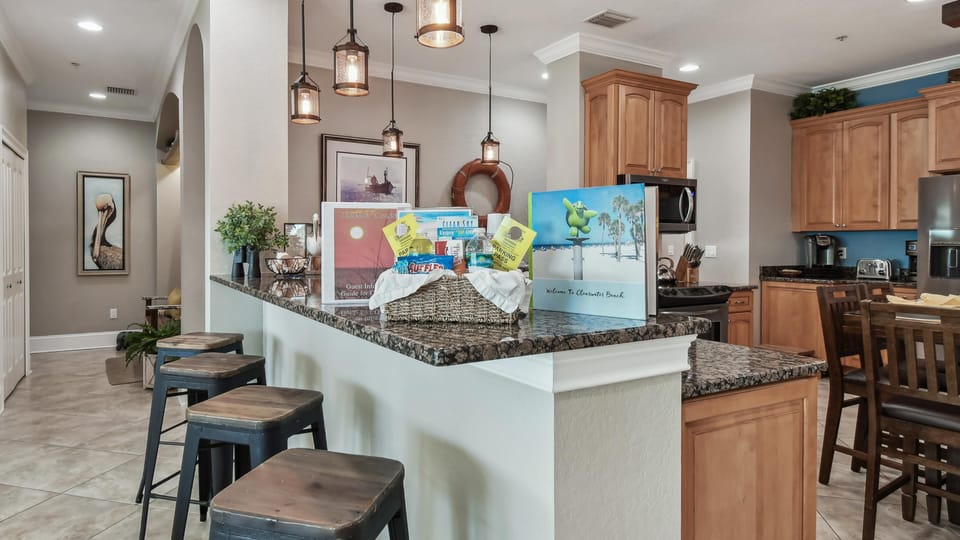 Welcome basket w/  2 parking passes, snacks, water, Welcome Book, and FAQs .