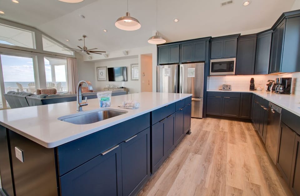 Kitchen with Bar Seating on Fourth Level