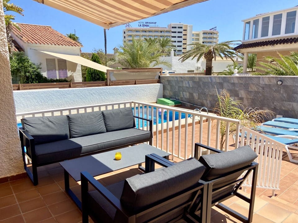 Rear Terrace with sofa seating and Dining area plus shade Sails 