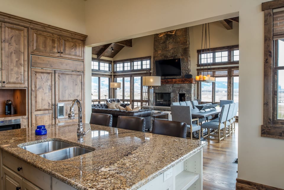 Your gourmet kitchen opens seamlessly to a cozy living space where you can cook, dine, and relax all in one beautiful flow. Granite counters, rustic wood beams, and mountain views create the perfect backdrop for your getaway.