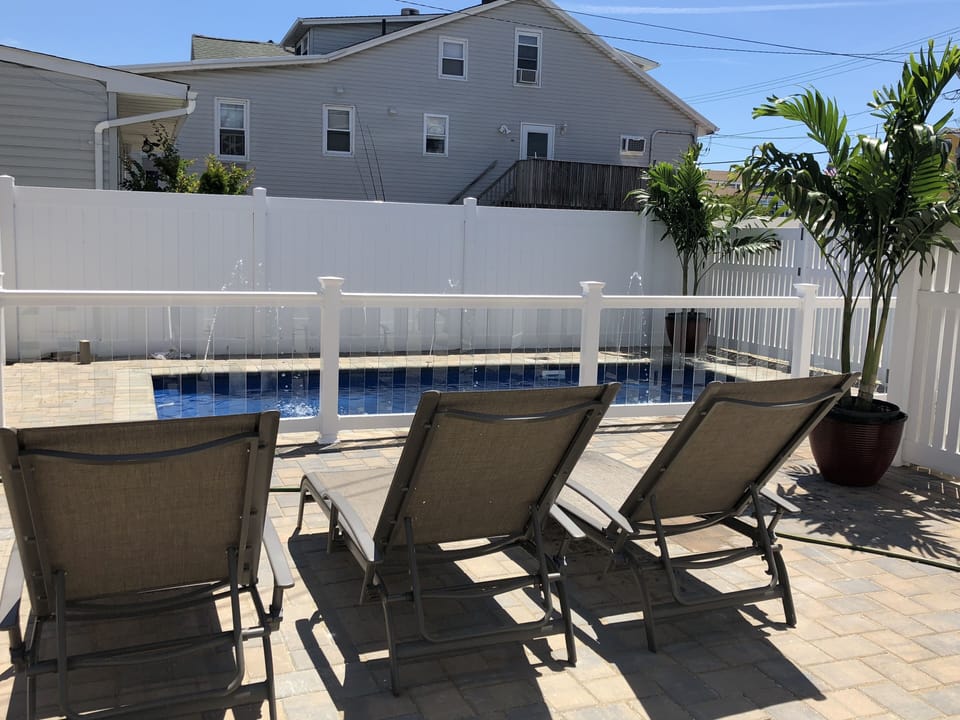 Lounge chairs with shared pool area