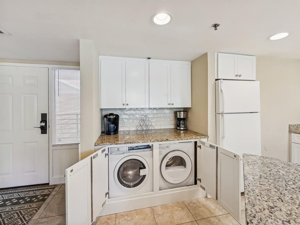 Laundry Area with Hidden Washer and Dryer at 2316 Villamare