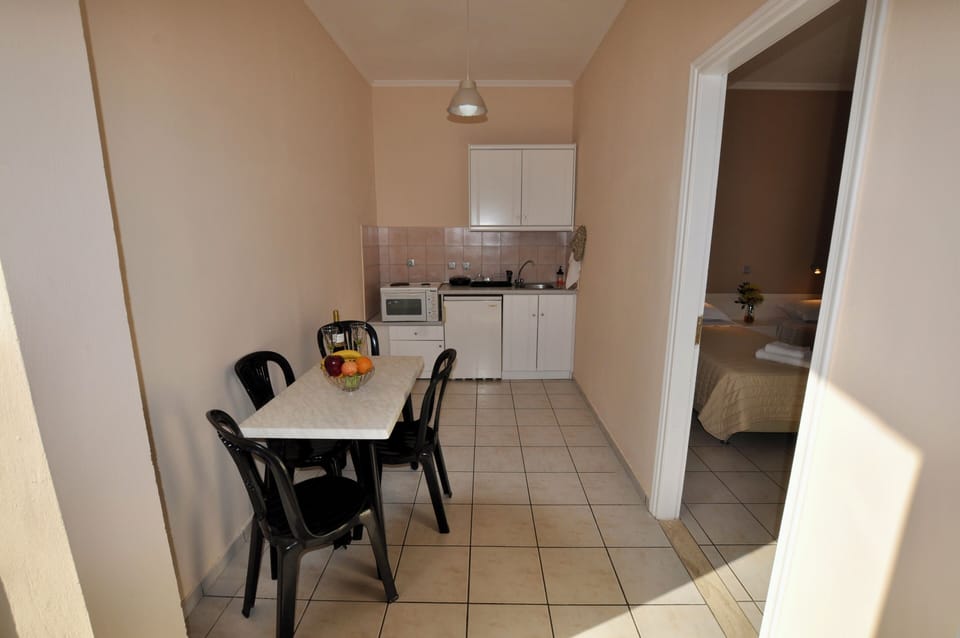 Upstairs, the 2-bedroom apartment features a dining area and kitchenette