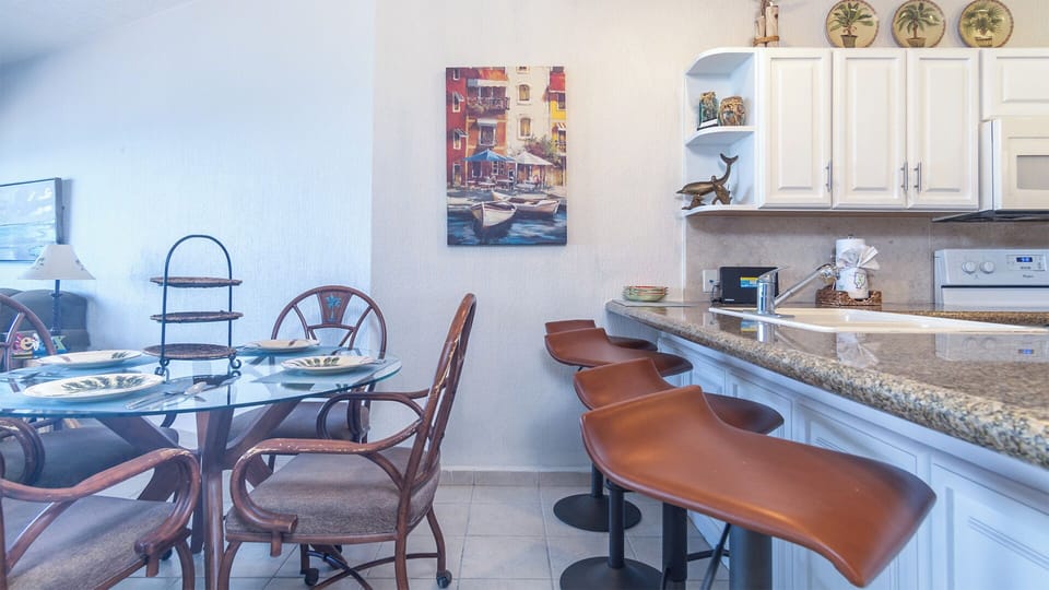 Leather bar stool accompany the dining table in offering extra seating by the dining table.
