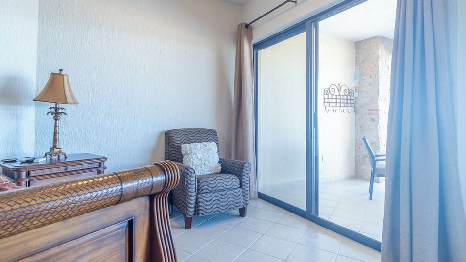 Patio access and an additional chair in the main bedroom.