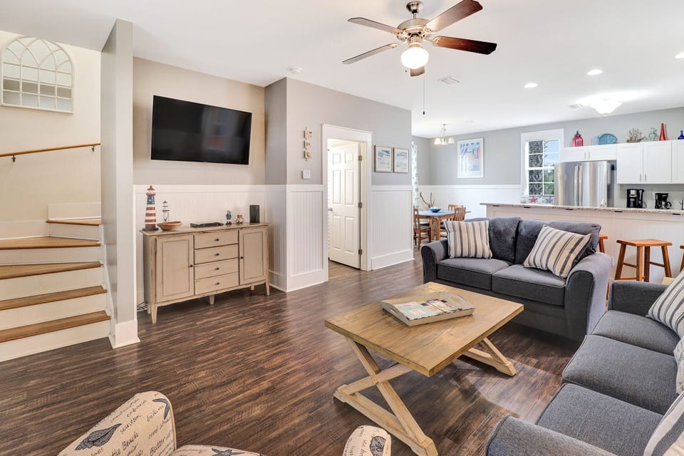The cozy living area features a half bath with full laundry facilities