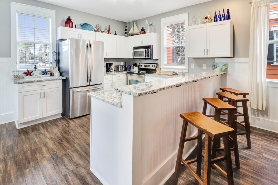 The kitchen features a breakfast bar perfect for starting your morning.