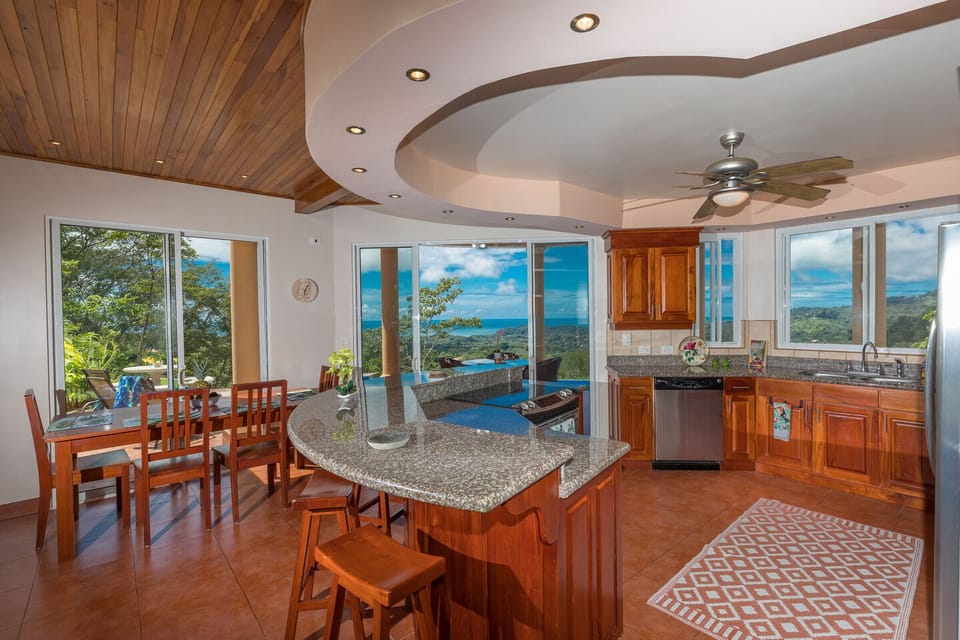 Open American style kitchen with ocean and valley views
