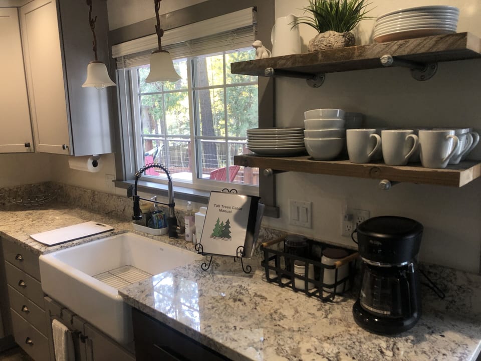 Drip Coffee maker, coffee grinder and sugar provided.