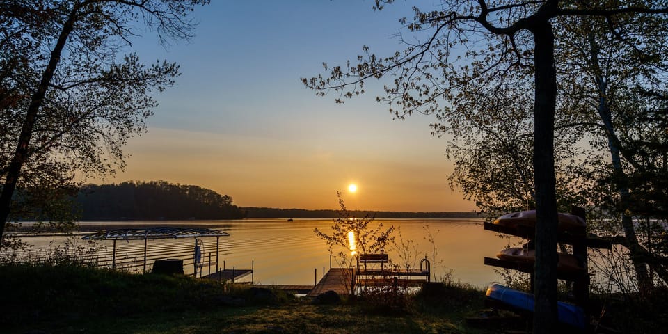 Summer sunrise over Lake Sylvan from the cabin