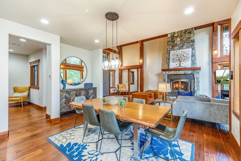 Dine and relax with stone gas fireplace in this luxury retreat home