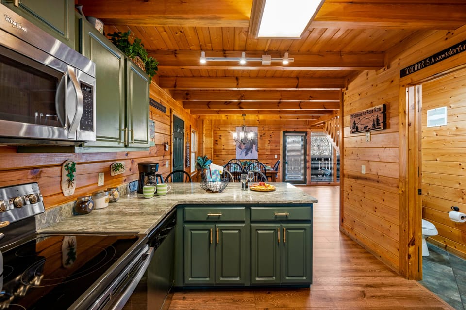 Culinary Haven: Chic Green Kitchen with Granite, Espresso Machine 