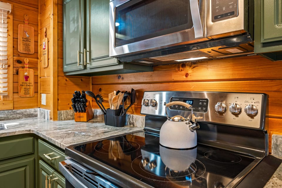 Freshly Painted Green Kitchen, Complete with Granite Counters & Essentials.