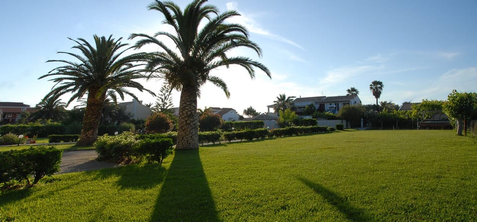 Well-kept gardens, and free parking in the property