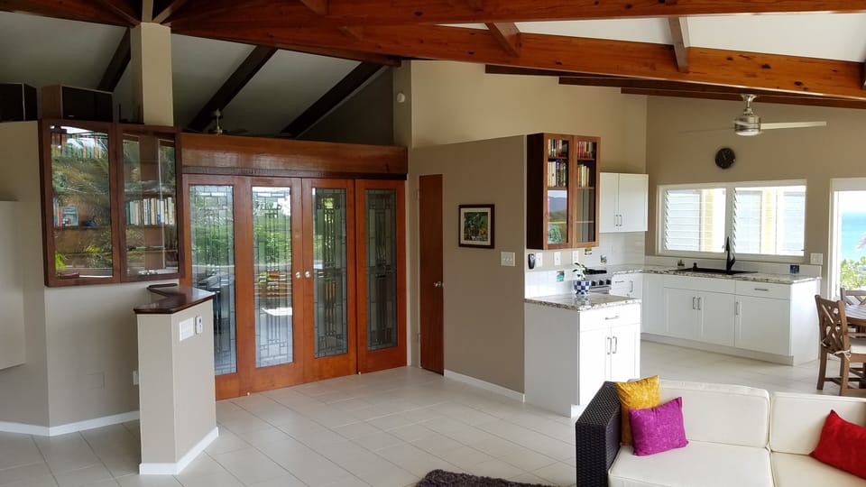 Bedroom is tucked peacefully behind the expansive living space