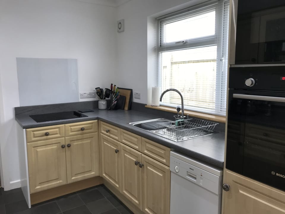 Modern kitchen equipped with a vast selection of utensils and great appliances!